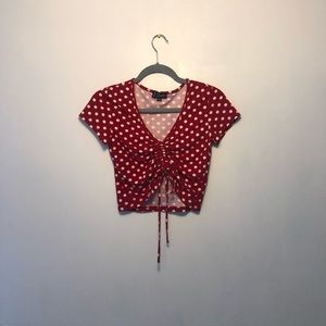 J for Justify crop top with a polka dot pattern and a tie in the front!